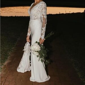 Wedding gown. Unaltered- bustle added. Size 8. Ivory.